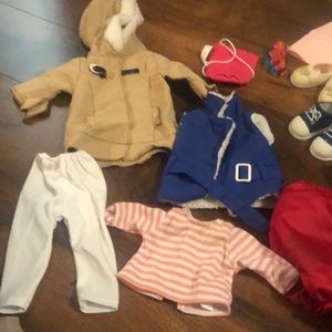 Bundle of different size doll clothes